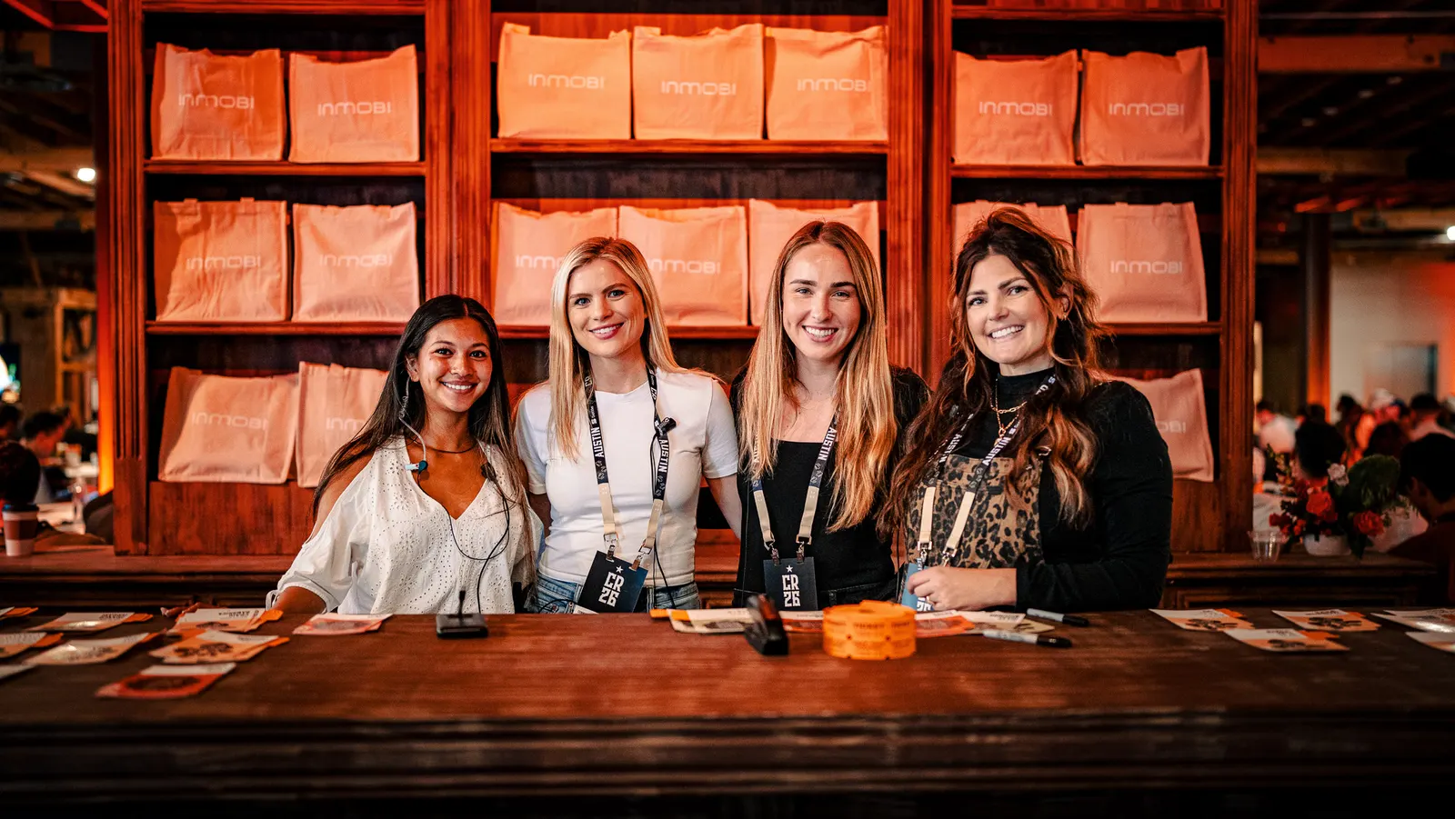 The smiling registration team behind the check-in desk