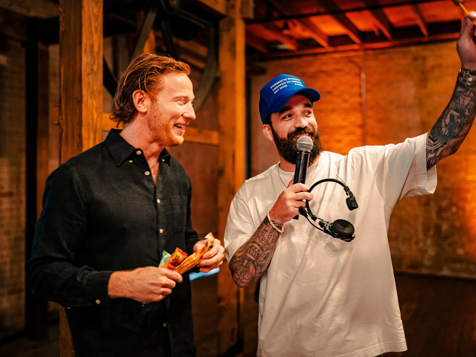The host laughing with an attendee during a live interview