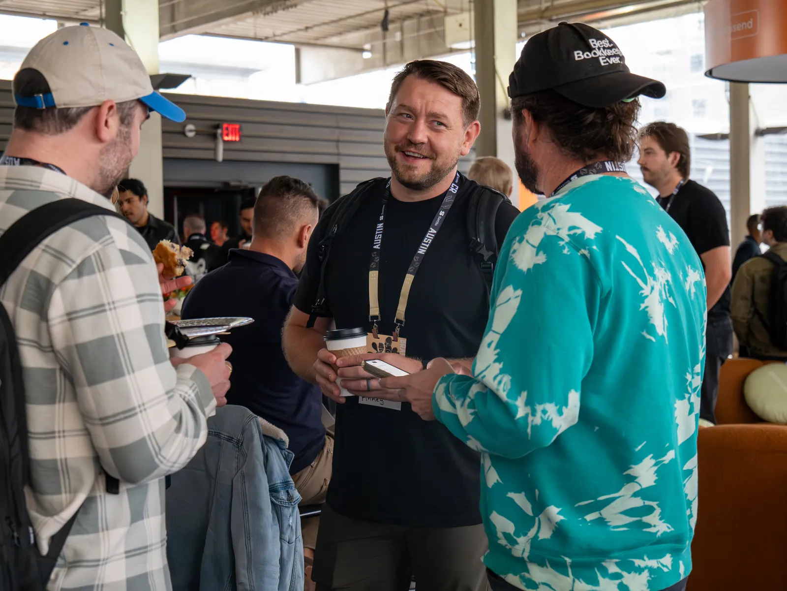 Attendees laughing over coffee