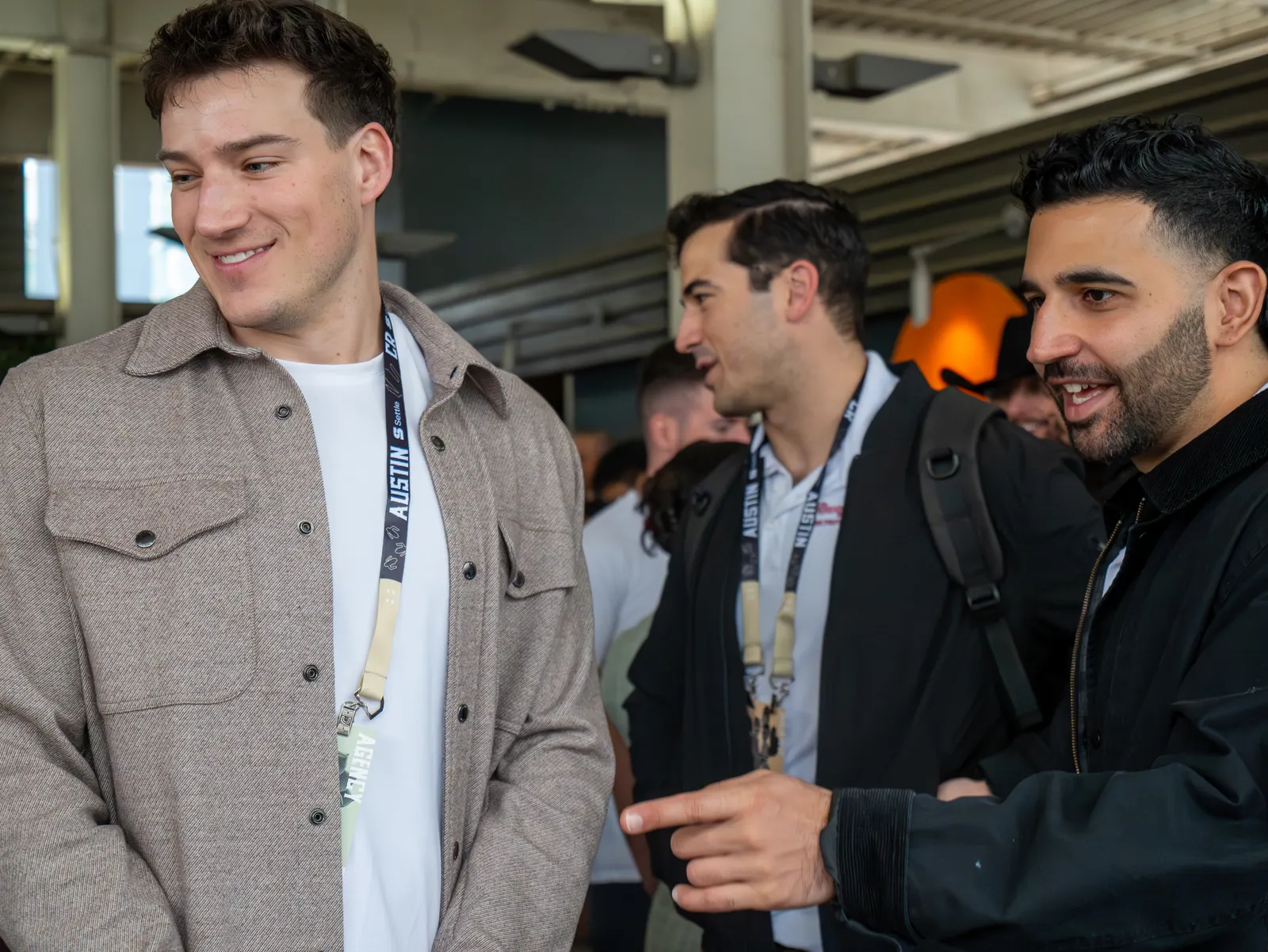 Attendees smiling in conversation