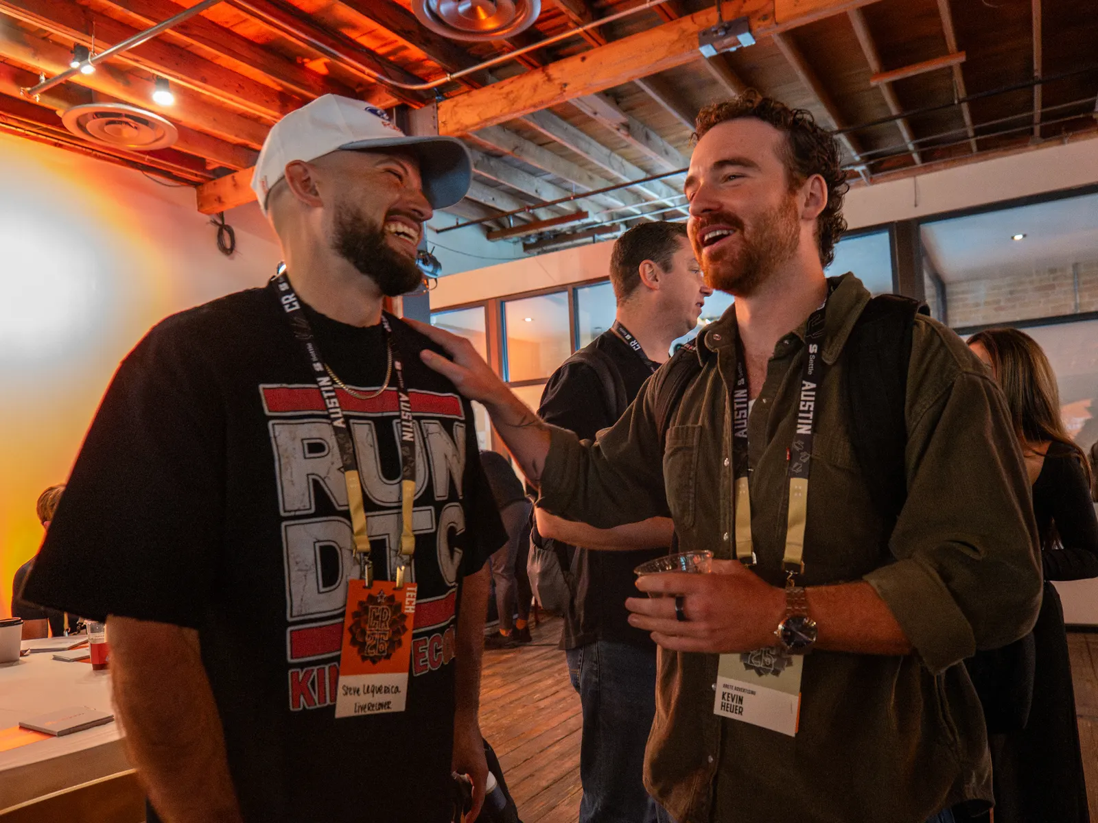 Two attendees sharing a big laugh