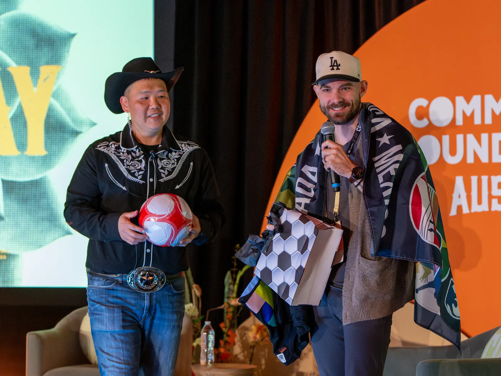 Prize winners on stage with the cowboy hosts